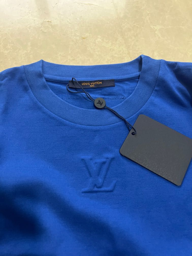 Louis Vuitton Men embossed LV T shirt, Men's Fashion, Tops & Sets, Tshirts  & Polo Shirts on Carousell