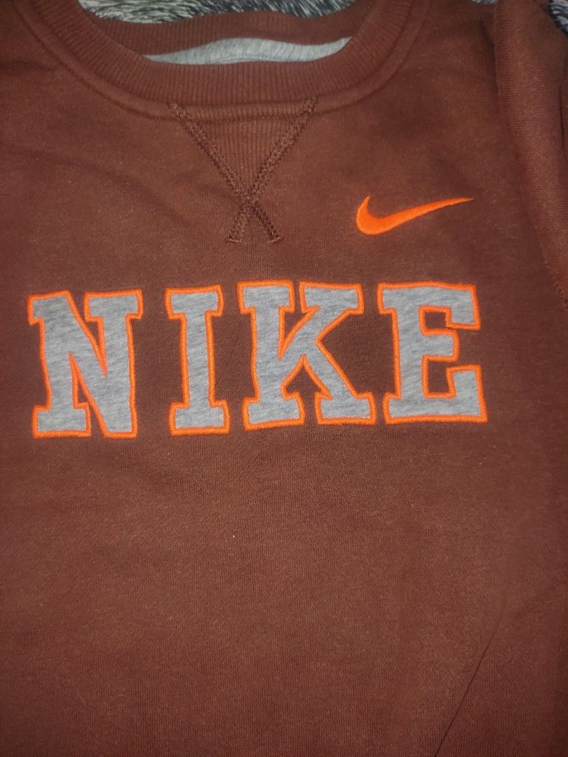 rust color nike sweatshirt