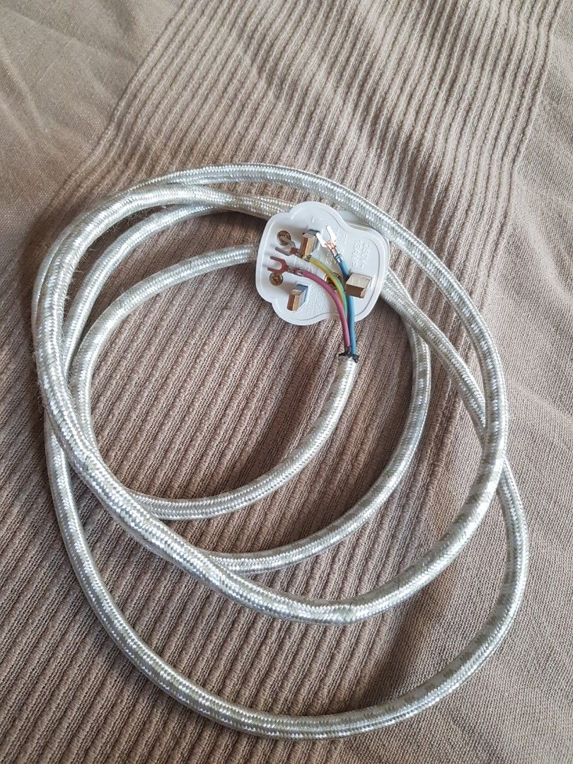 Electric iron cable outlet