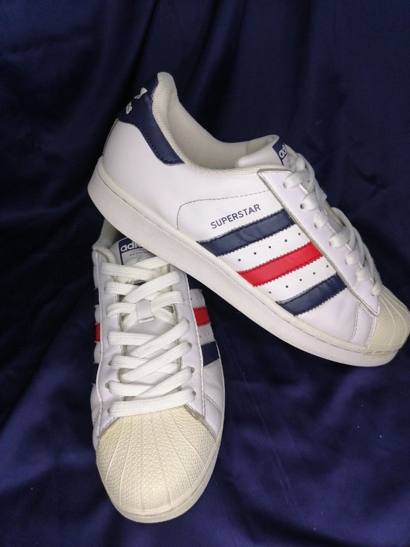 Superstar white red store and blue stripe trainers