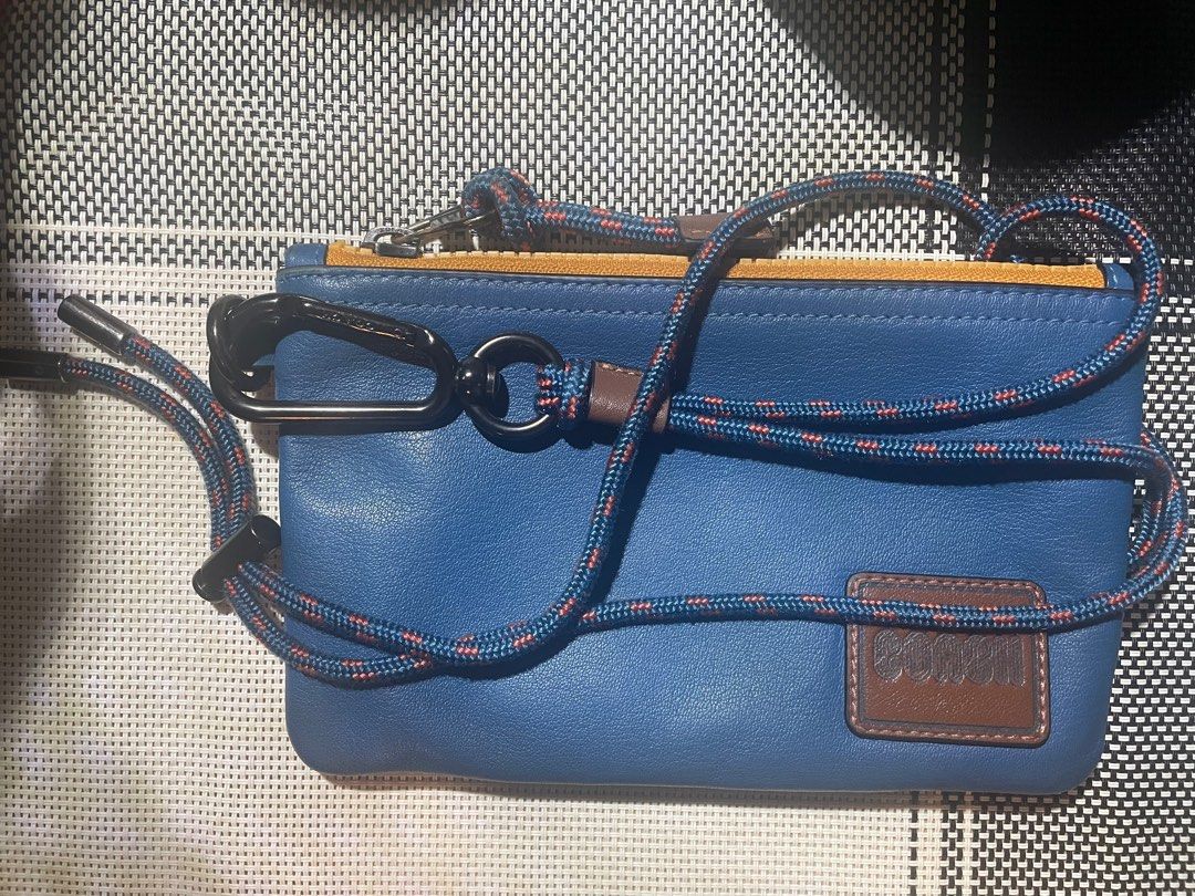 Coach Mini Sling (Category: Wallets & Card Holders) located in Mandaluyong City. Submitted by ipau888 (Listing ID 1209726638, Image 1). Description: Brand: Coach Color: Multi RFS: Not using it anymore Complete Package With Paperbag and dust bag..