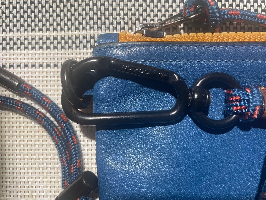 Coach Mini Sling (Category: Wallets & Card Holders) located in Mandaluyong City. Submitted by ipau888 (Listing ID 1209726638, Image 3). Description: Brand: Coach Color: Multi RFS: Not using it anymore Complete Package With Paperbag and dust bag..