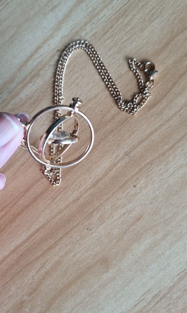 Time turner necklace (from Harry Potter) (Category: Necklaces) located in Quezon City. Submitted by averyav (Listing ID 1209768289, Image 2). Description: Time turner necklace as featured in Harry Potter ⚡️ Used once only, good as new! No flaws RFS: barely used.