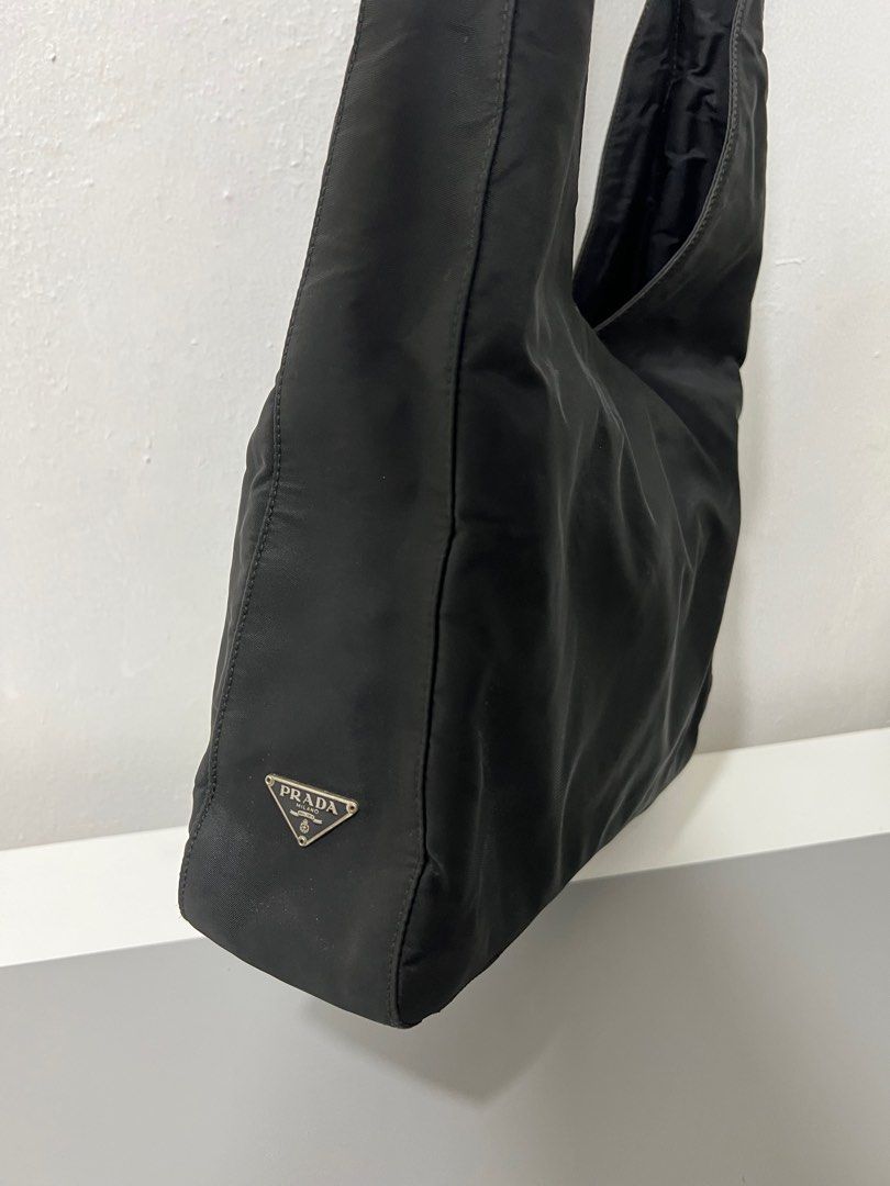 Authentic Prada Bag from Japan (Category: Luxury Bags & Wallets) located in Las Pinas. Submitted by obsessorizeph (Listing ID 1209924575, Image 2). Description: Authentic Prada Shoulder Bag (with flaw on the handle) Color — Black H — 58cm W — 31cm Location — Las Piñas City, Metro Manila Mode of Payment — GCash, BDO or BPI ₱6000.