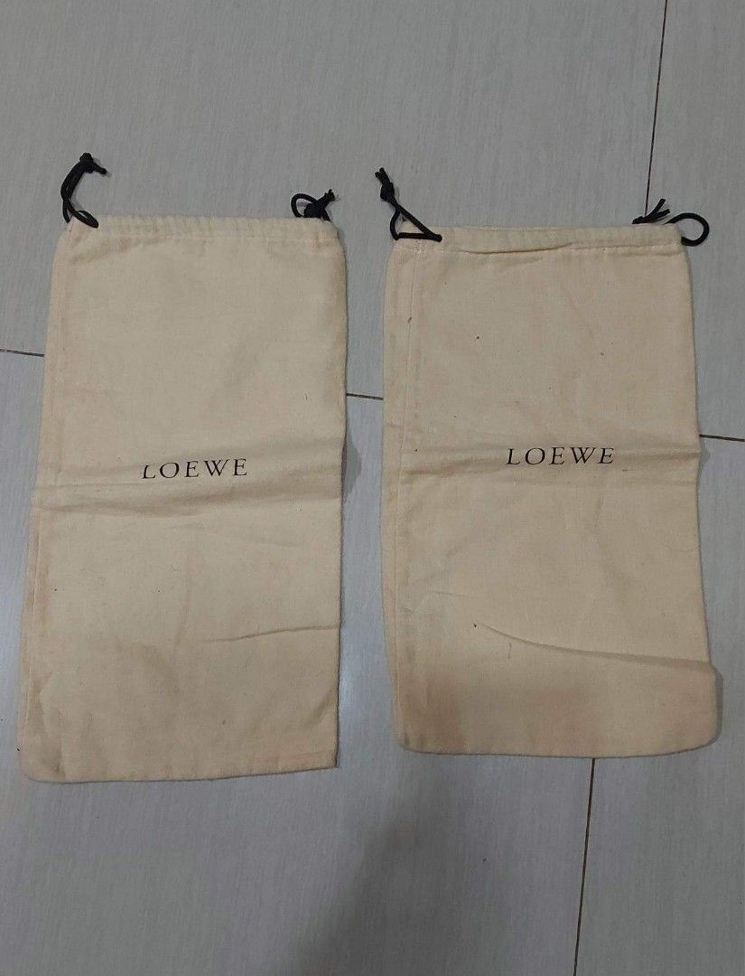 Loewe 2pcs dust bag (Category: Purses & Pouches) located in Quezon City. Submitted by threetwotwo2ndaccount (Listing ID 1209884201, Image 1). Description: loewe 2pcs dust bag bundle size: 13.5"8" bawal sa maselan bawal sa barat.