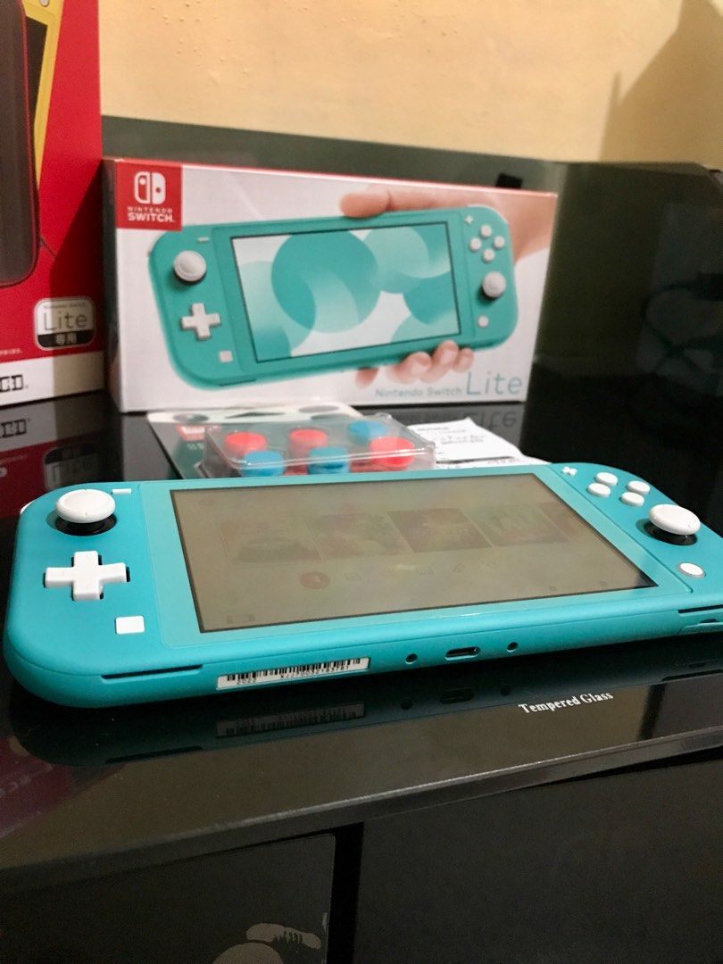 Nintendo Switch Lite With Games, Video Gaming, Video Game Consoles, Nintendo  On Carousell