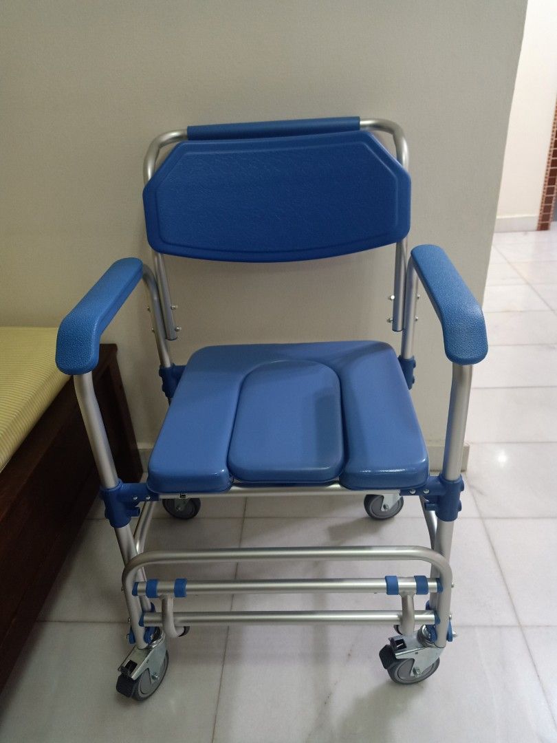 Wheelchair with outlet toilet seat