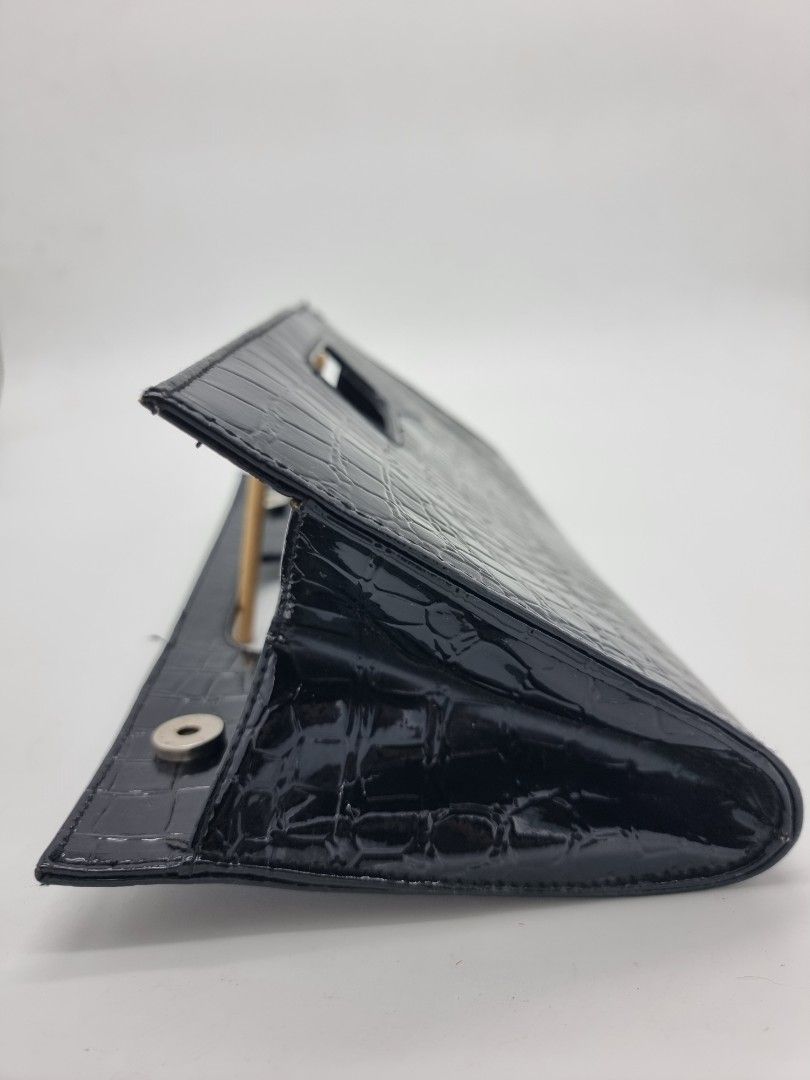 Black Classy Clutch with Magnetic Enclosure (Category: Clutches) located in Quezon City. Submitted by dmrtea (Listing ID 1210155923, Image 3). Description: Height 16.5cm Length 33cm Width 3cm.