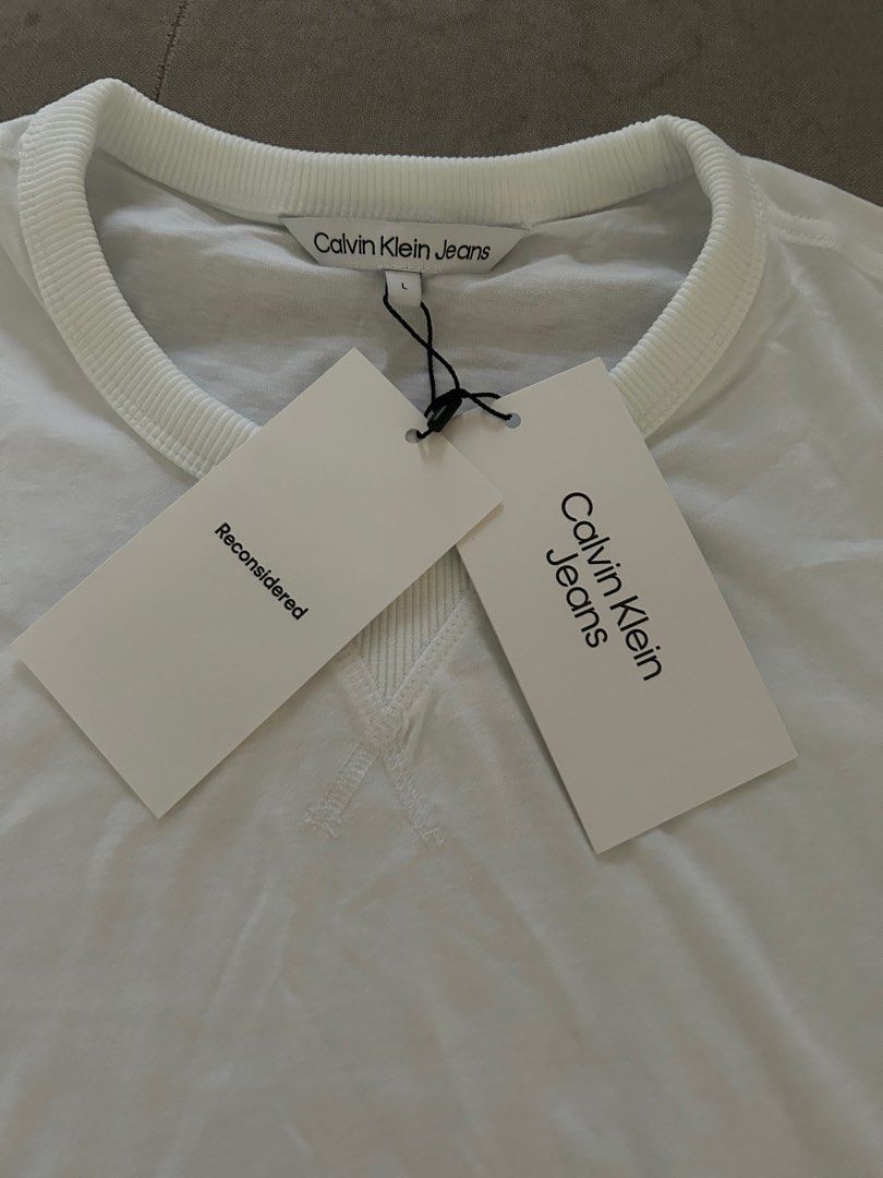 Brand new with tag Calvin Klein Jeans White cotton tee, Men's Fashion, Tops  & Sets, Tshirts & Polo Shirts on Carousell