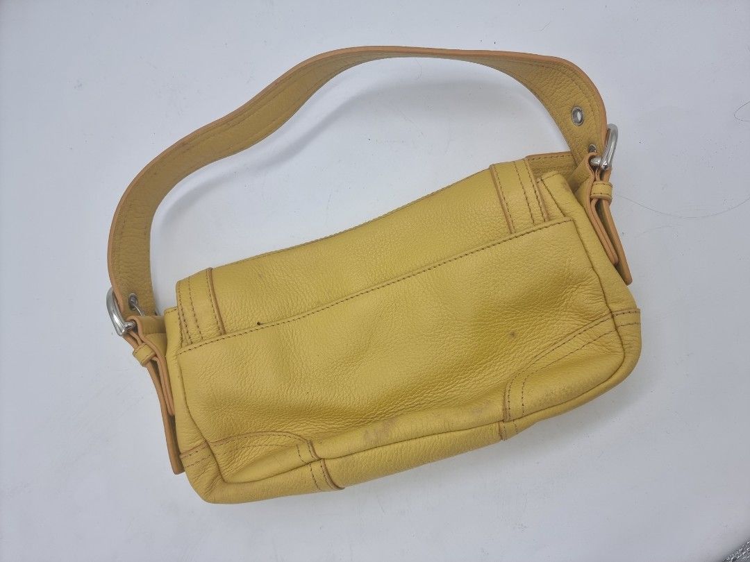 Danier Genuine Leather Shoulder Bag Yellow (Category: Shoulder Bags) located in Quezon City. Submitted by dmrtea (Listing ID 1210151682, Image 2). Description: - never used - visible stains can be easily cleaned with appropriate cleaner; stains caused by having been in the closet too long.