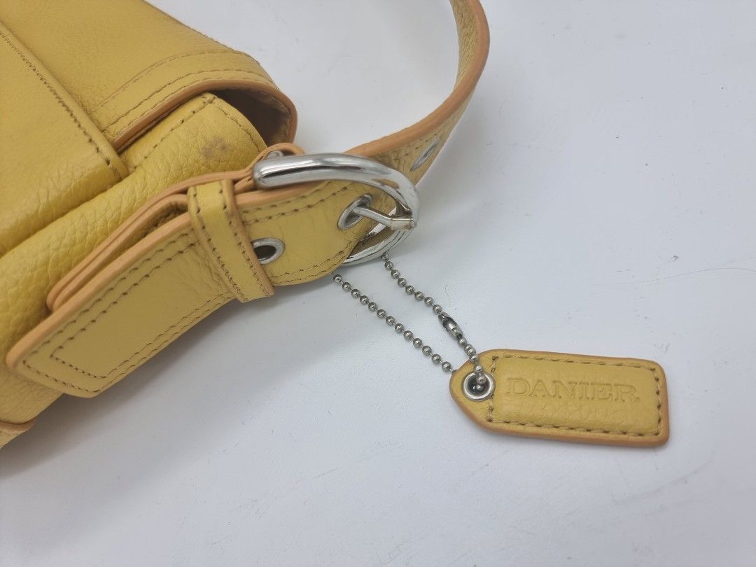 Danier Genuine Leather Shoulder Bag Yellow (Category: Shoulder Bags) located in Quezon City. Submitted by dmrtea (Listing ID 1210151682, Image 3). Description: - never used - visible stains can be easily cleaned with appropriate cleaner; stains caused by having been in the closet too long.