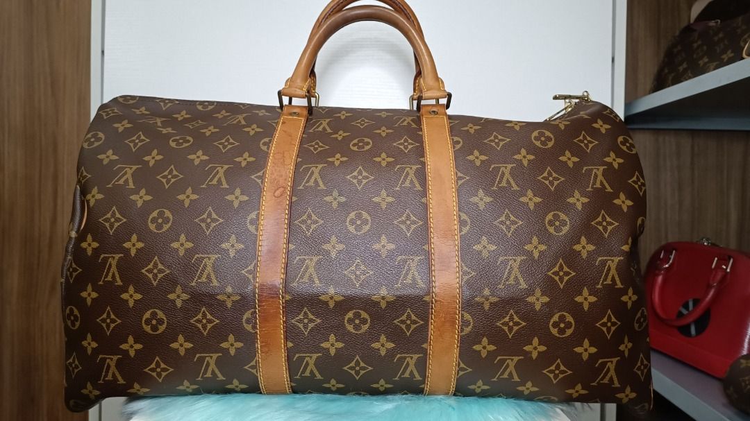 louis vuitton keepall 50 (Category: Luxury Bags & Wallets) located in Las Pinas. Submitted by jvega08 (Listing ID 1210157001, Image 3). Description: selling lv keepall 50 in good condition. some cracks and water stain on vachetta leather but no cracks/damge on vinyl.. bag only...