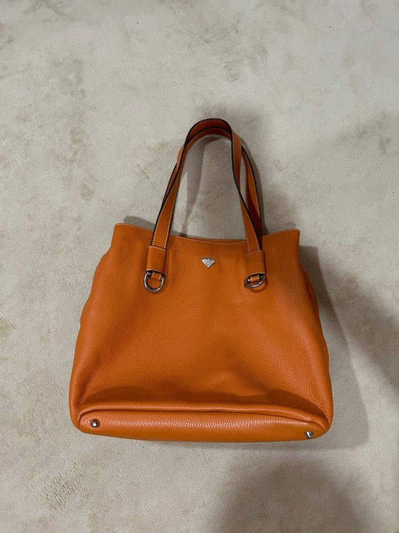 Oliver Weber Handbag Orange (Category: Shoulder Bags) located in Quezon City. Submitted by poochiyena (Listing ID 1210144535, Image 1). Description: 10/10 condition never used, just stored good quality leather bag bought in Austria rfs: decluttering .