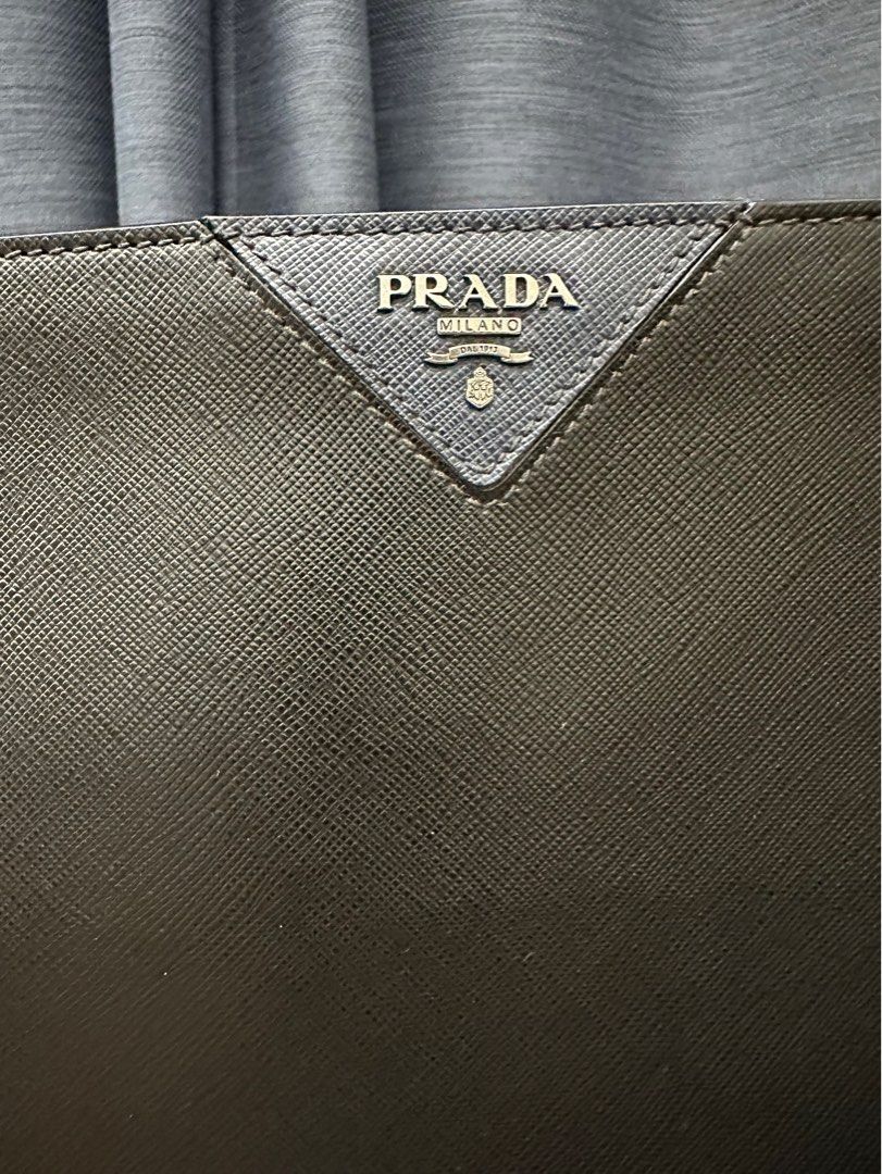 Prada Clutch fit 13inch Mac Air (Category: Luxury Bags & Wallets) located in San Fernando. Submitted by AuthenticFindsbylei (Listing ID 1196021857, Image 2). Description: Rank A condition sign of usage only no flaws. Guaranteed Authentic. A4 size.