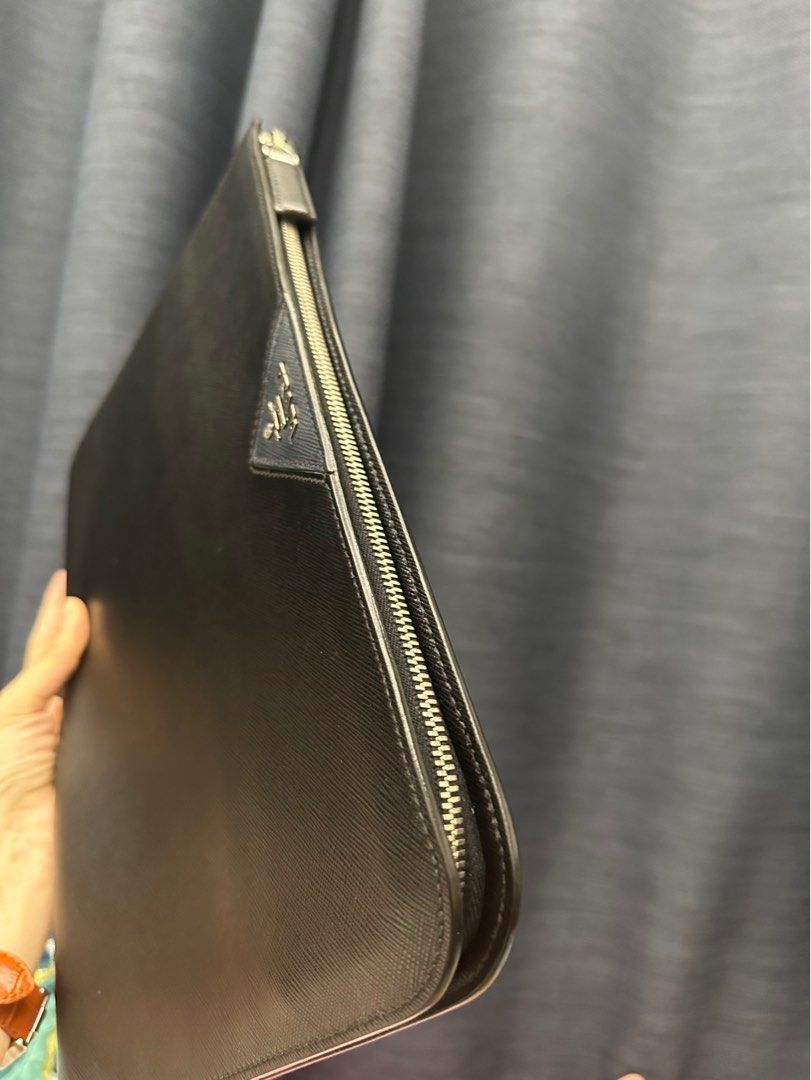 Prada Clutch fit 13inch Mac Air (Category: Luxury Bags & Wallets) located in San Fernando. Submitted by AuthenticFindsbylei (Listing ID 1196021857, Image 3). Description: Rank A condition sign of usage only no flaws. Guaranteed Authentic. A4 size.