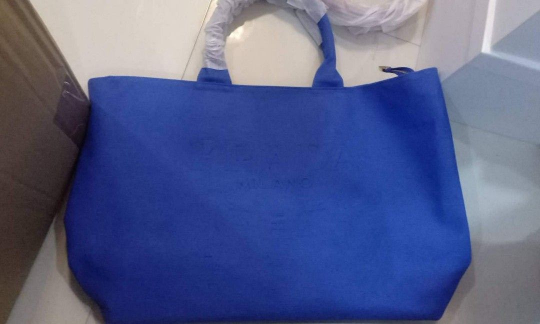 Prada embossed logo tote, Women's Fashion, Bags & Wallets, Crossbody