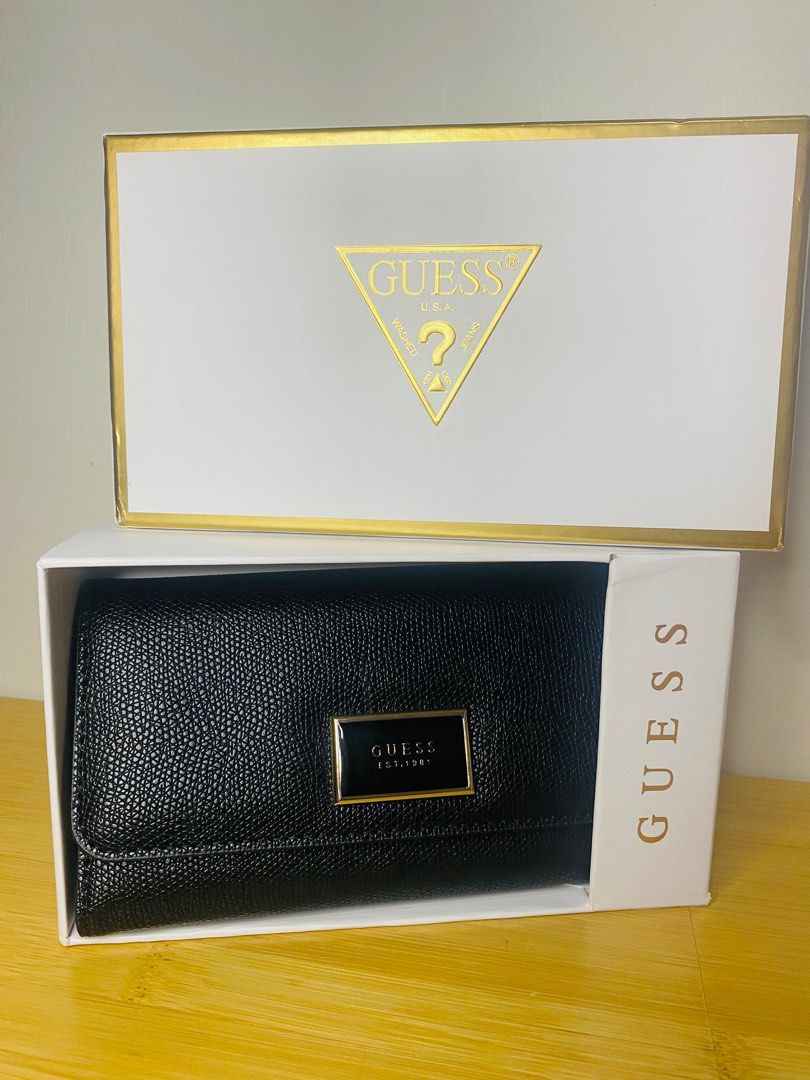 💯% Original GUESS TRIFOLD WALLET (Category: Wallets & Card holders) located in Pasig City. Submitted by khaseyprelovedph23 (Listing ID 1210370010, Image 1). Description: Very Classy and Simple but very elegant in person.. Bought it from the US 💯% original no flaws no scratches stored it inside the box lang never been used. RFS: too much wallet na nagustuhan ko lang siya nung nakita ko kaya binili ko😅😊 .
