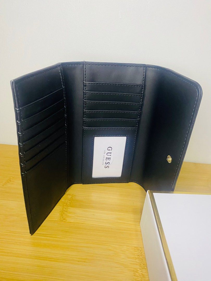 💯% Original GUESS TRIFOLD WALLET (Category: Wallets & Card holders) located in Pasig City. Submitted by khaseyprelovedph23 (Listing ID 1210370010, Image 3). Description: Very Classy and Simple but very elegant in person.. Bought it from the US 💯% original no flaws no scratches stored it inside the box lang never been used. RFS: too much wallet na nagustuhan ko lang siya nung nakita ko kaya binili ko😅😊 .