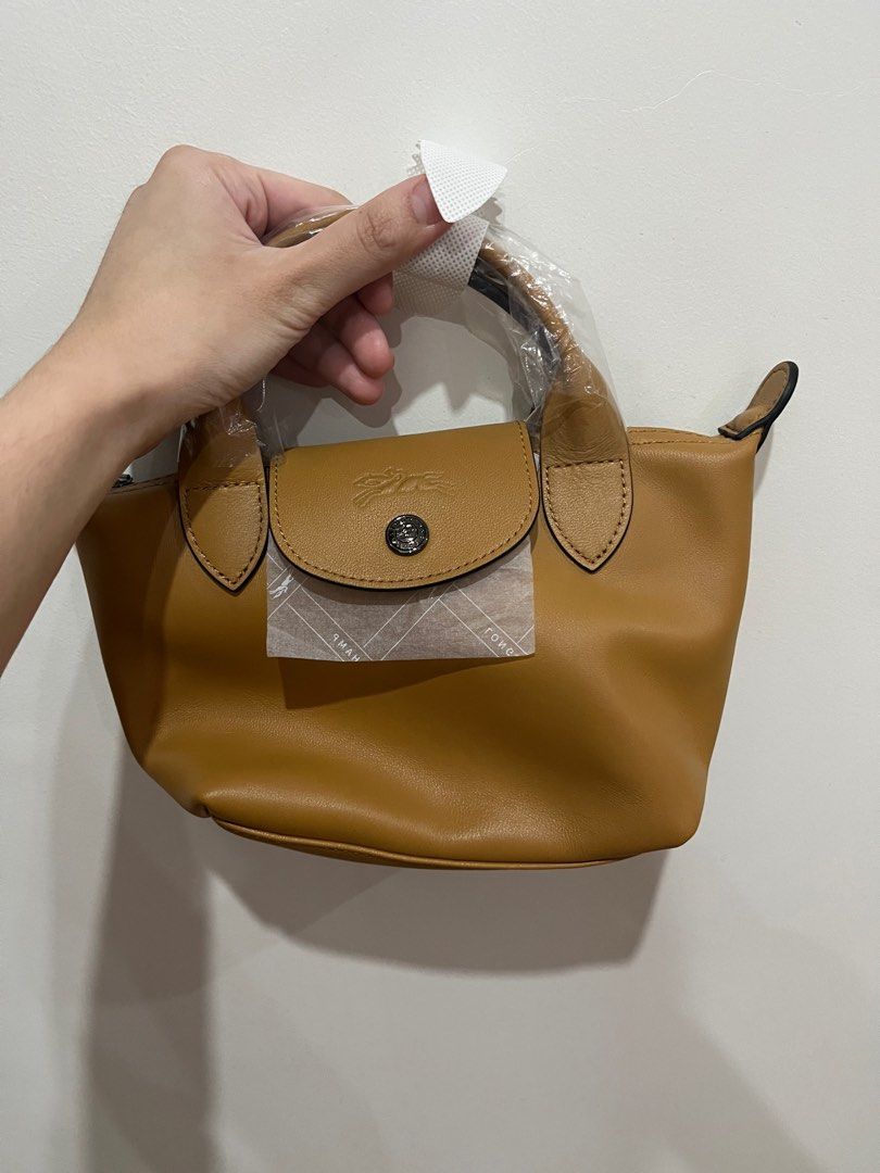Brand New and Authentic Longchamp Le Pliage Cuir Mini (Category: Cross-body Bags) located in Quezon City. Submitted by annadomshops (Listing ID 1210244787, Image 3). Description: Brand new and authentic Bought from Europe Longchamp Le Pliage Cuir Mini Genuine leather With paperbag, dustbag, box Selling for 9.5k.