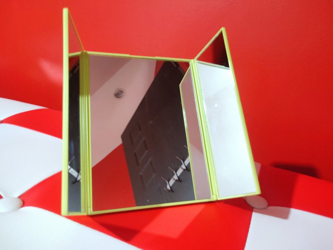 Miniso Foldable Triple Mirror (Category: Other Accessories) located in Makati City. Submitted by lishey (Listing ID 1207152435, Image 1). Description: Miniso Foldable Triple Mirror Apple-Green Color Portable Mirror Easy to Carry Brand New. Never been used. RFS: Decluttering stuff Mode of Payment: Gcash or BPI Delivery can be made thru Grab or Lalamove Shipping/Delivery fee is shouldered by the buyer.