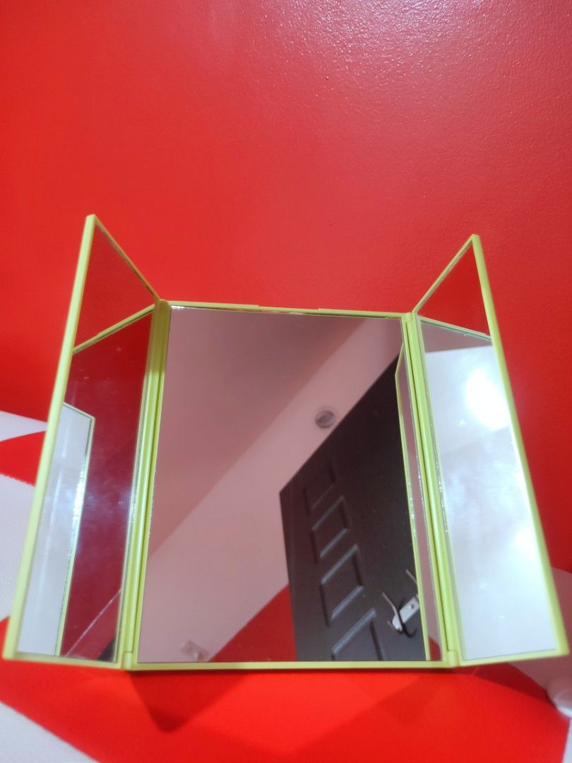 Miniso Foldable Triple Mirror (Category: Other Accessories) located in Makati City. Submitted by lishey (Listing ID 1207152435, Image 2). Description: Miniso Foldable Triple Mirror Apple-Green Color Portable Mirror Easy to Carry Brand New. Never been used. RFS: Decluttering stuff Mode of Payment: Gcash or BPI Delivery can be made thru Grab or Lalamove Shipping/Delivery fee is shouldered by the buyer.