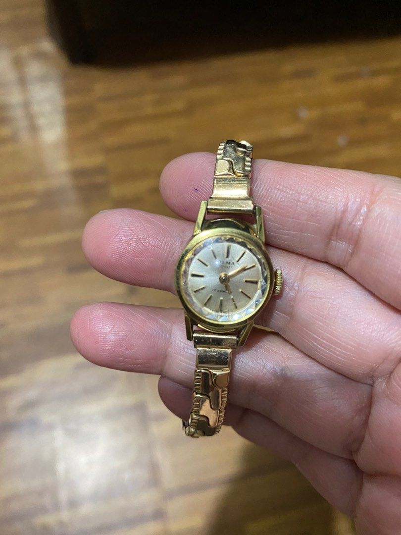 Olma outlet gold watch