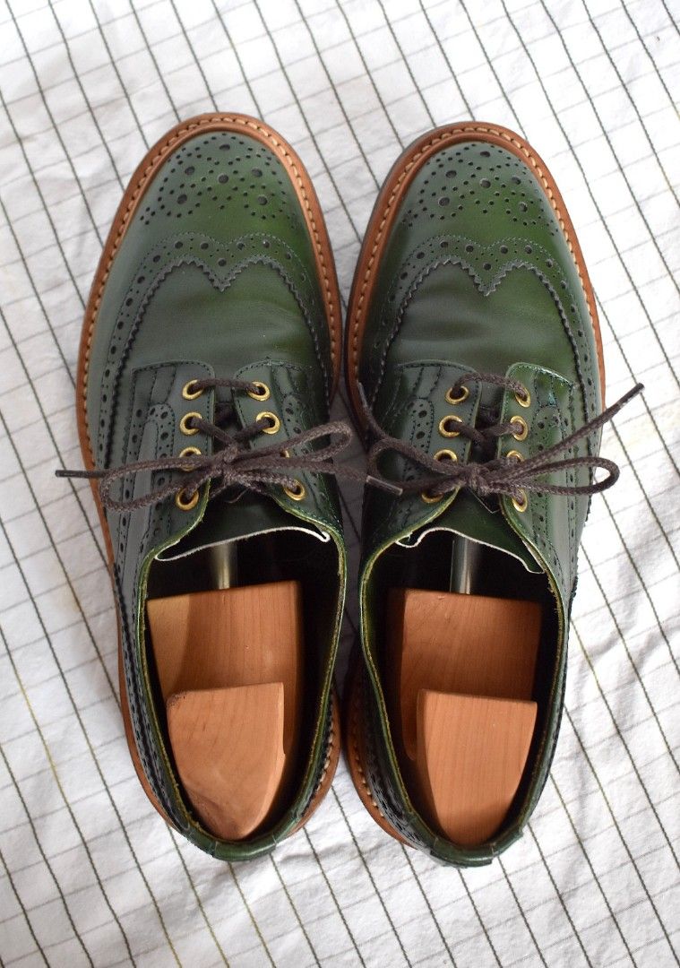 Tricker's shop green brogues