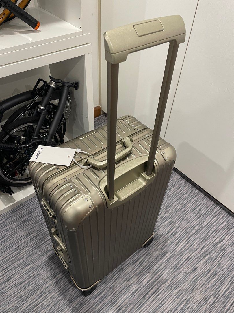 Rimowa Check in M Titanium lifetime warranty, Hobbies & Toys, Travel