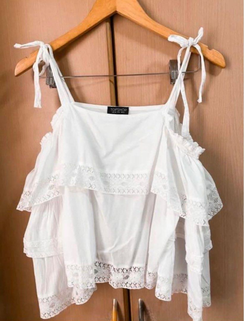 Topshop Cold Shoulder Dainty Top (Category: Blouses) located in Manila. Submitted by amiax (Listing ID 1210716347, Image 1). Description: Topshop Cold Shoulder blouse Size: Medium Used once only! Bought for 1500 before Super nice!.