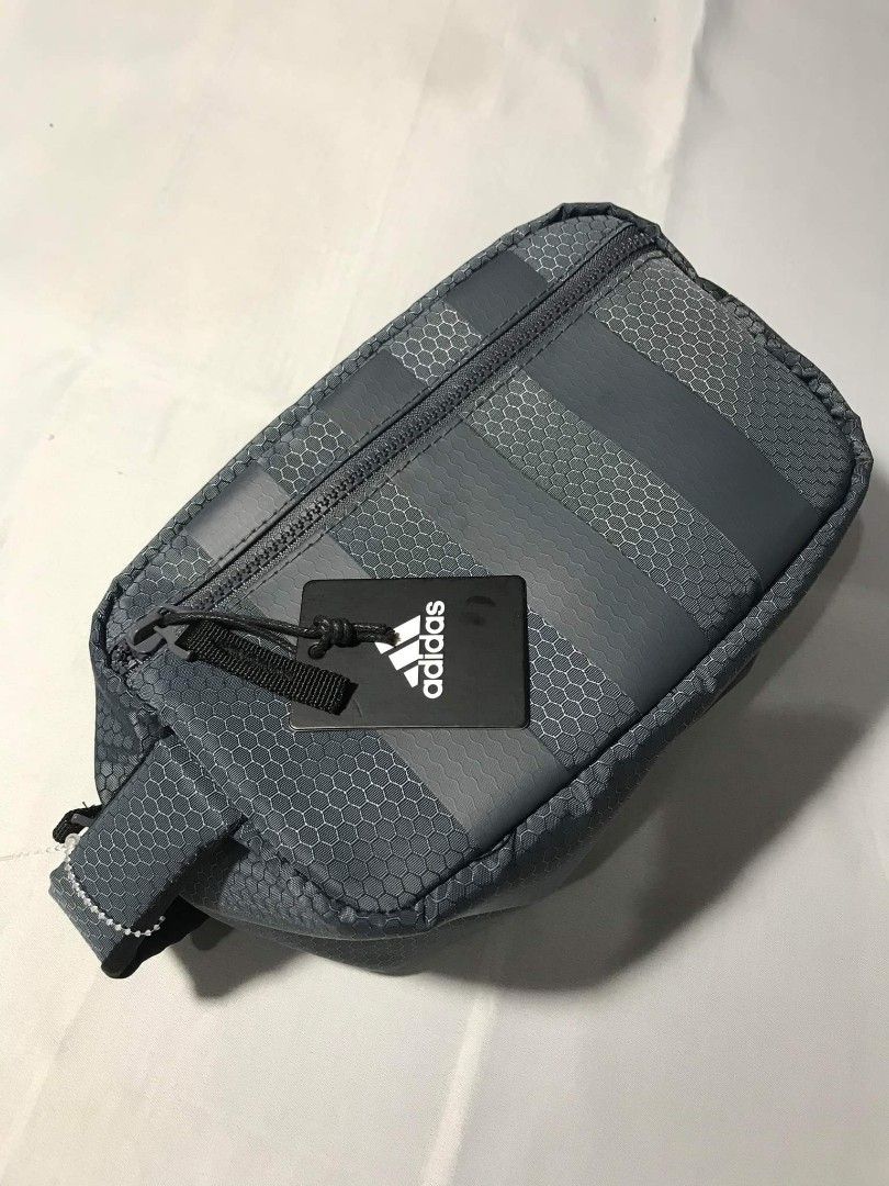 Adidas Team Toiletry Kit (Category: Belt bags, Clutches and Pouches) located in San Fernando. Submitted by randomstuffphilippines (Listing ID 1211026984, Image 1). Description: Dimensions :6" x 5" x 9" 100% polyester Wipeable material Toiletries travel bag Zip pocket outside Zip closure Color: Onix Grey Pasalubong ng tito ko sakin galing US . Fresh galing sa balikbayan box niya.😂 Benta ko nalang since okay pa naman yung ginagamit kong toiletry b