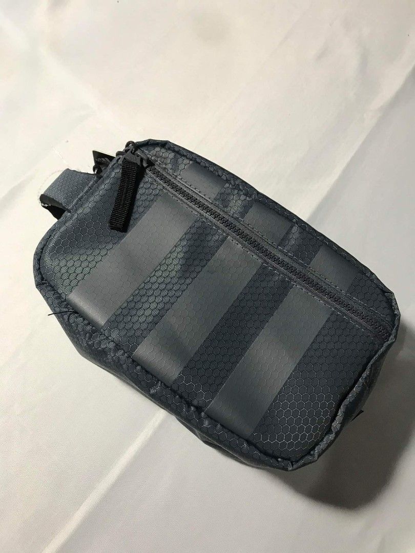Adidas Team Toiletry Kit (Category: Belt bags, Clutches and Pouches) located in San Fernando. Submitted by randomstuffphilippines (Listing ID 1211026984, Image 2). Description: Dimensions :6" x 5" x 9" 100% polyester Wipeable material Toiletries travel bag Zip pocket outside Zip closure Color: Onix Grey Pasalubong ng tito ko sakin galing US . Fresh galing sa balikbayan box niya.😂 Benta ko nalang since okay pa naman yung ginagamit kong toiletry b