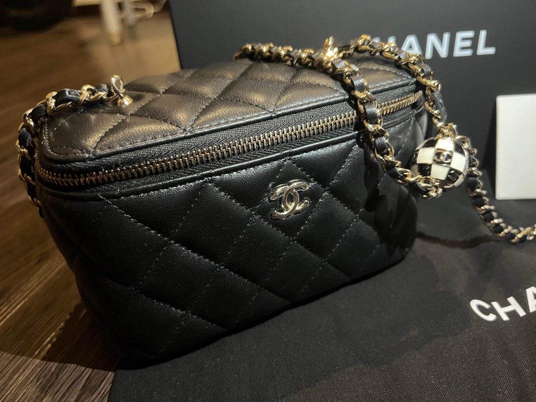 Chanel bag with ball on chain top
