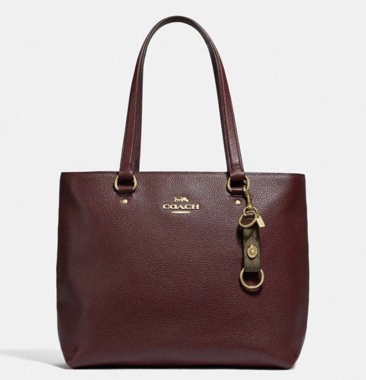 COACH Trigger Snap Bag Charm in Signature Canvas (Category: Other Accessories) located in Antipolo. Submitted by random.findss (Listing ID 1211005079, Image 3). Description: - slightly negotiable - 100% authentic from coach 🇨🇦 - in color khaki - 2 are onhand.