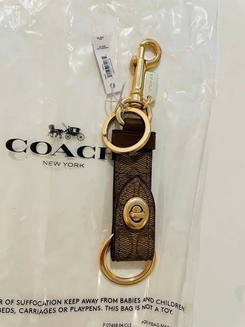 COACH Trigger Snap Bag Charm in Signature Canvas (Category: Other Accessories) located in Antipolo. Submitted by random.findss (Listing ID 1211005079, Image 2). Description: - slightly negotiable - 100% authentic from coach 🇨🇦 - in color khaki - 2 are onhand.