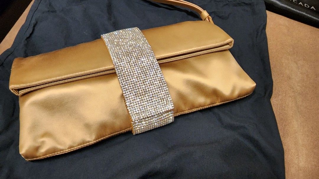 Escada Gold Satin Clutch Bag Evening (Category: Luxury Bags & Wallets) located in Pasig City. Submitted by clothesandthings_ (Listing ID 1211041853, Image 1). Description: authentic used twice no issues.