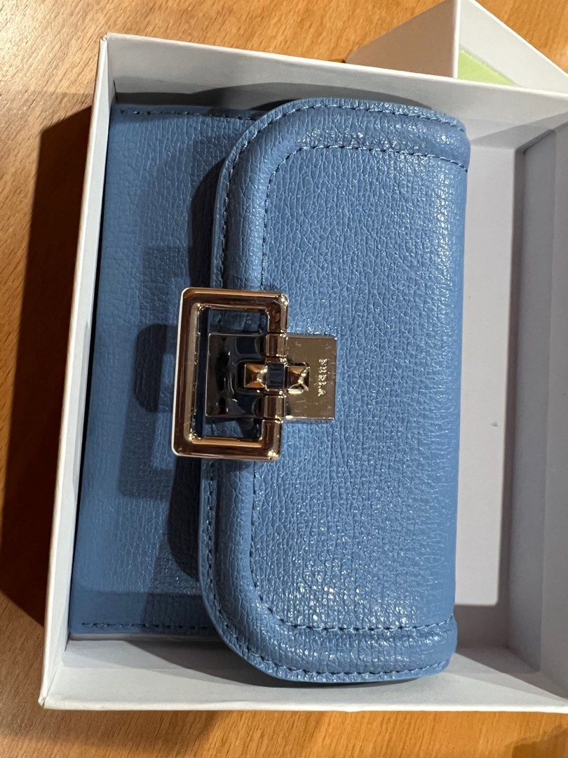 Authentic Furla Cardholder (Category: Luxury Bags & Wallets) located in Cebu City. Submitted by tala10 (Listing ID 1210927520, Image 1). Description: 🌸 SUMMER SALE, @ 4,500 instead of 6k 🌸 This is a brand new, unused Furla cardholder that I personally bought from Furla in New York back in June 2022. Guaranteed authentic. It has a unique clasp design and comes with a pocket at the back for keeping the most needed card accessible. The color is a 
