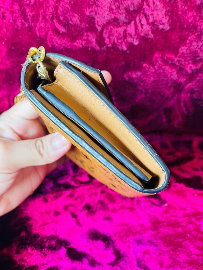 Mcm Sling Wallet (Category: Luxury Bags & Wallets) located in Valenzuela. Submitted by declutterstuffs0099 (Listing ID 1210934158, Image 3). Description: Mcm cognac With etikita Genuine lambskin leather inside Provided sling Very nice in actual Minor signs of use.