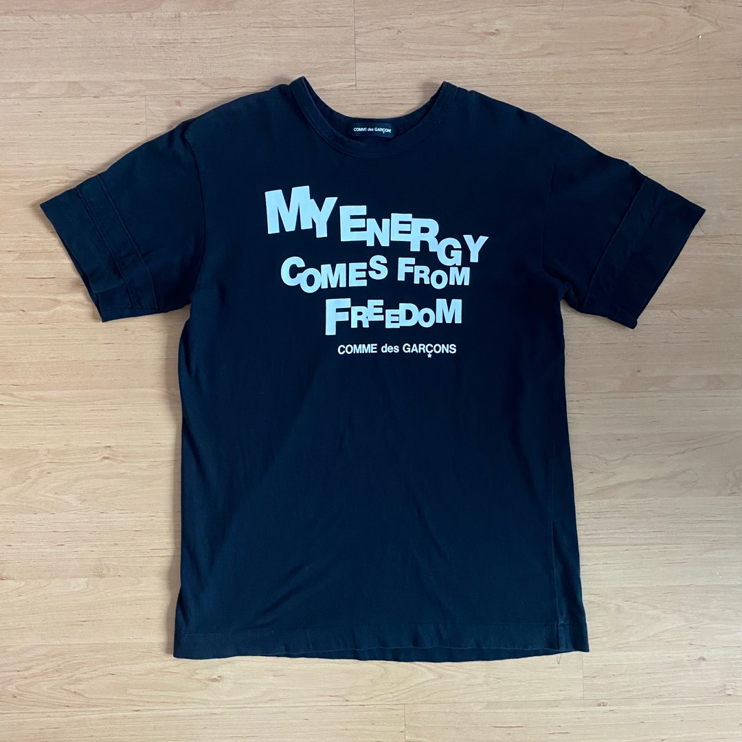 CDG My Energy Comes From Freedom Tee, Men's Fashion, Tops & Sets ...