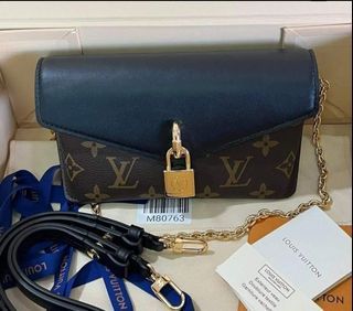Sold at Auction: Louis Brown, Louis Vuitton Mini Lockit Nomade Bag Leather  brown Keychain Accessory Key Holder