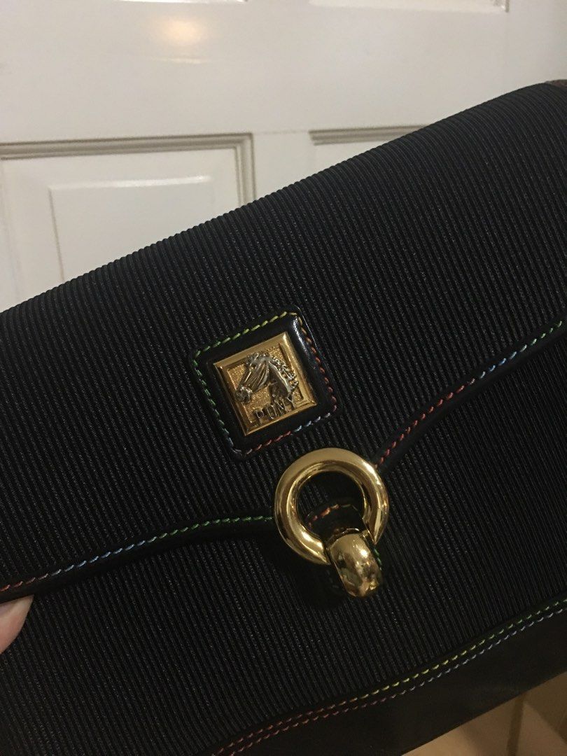 Pony Black Sling Bag (Category: Luxury Bags & Wallets) located in Makati City. Submitted by monoeraser_ (Listing ID 1211114646, Image 2). Description: Bought in HK a long time ago. Once lang nagamit pero since matagal na since nabili, nagpopowderish na yung inner pockets (2 pockets/check photo for reference) and medyo may signs of crack na yung pinaka lining nung bag. Other than that, the bag looks okay.