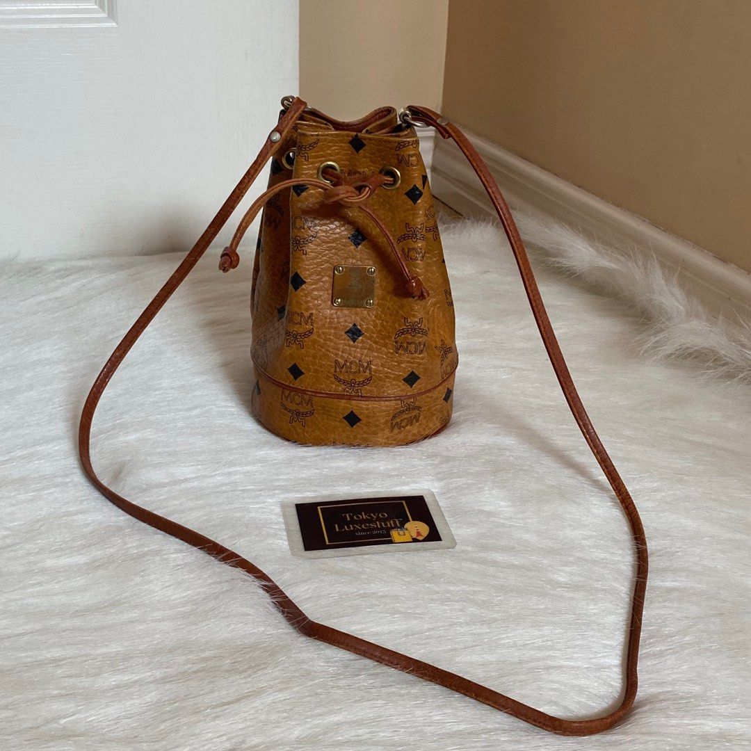 Mcm cognac bucket bag, Luxury, Bags & Wallets on Carousell