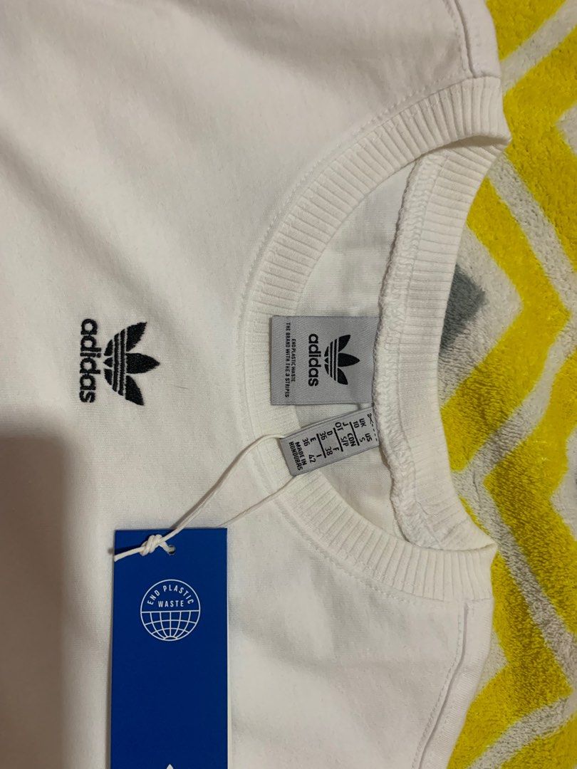 Adidas Women's White tee (oversized) (Category: Shirts) located in Pila. Submitted by hnyrms (Listing ID 1211383570, Image 2). Description: Oversized shirt. Size SMALL on tag but can fit up to Large Body frames. ‼️💯AUTHENTIC ‼️ Bought in the US Brand new. Binuksan lang po yung Plastic Pouch niya. Measurements are in the pictures. PRICE CAN BE NEGOTIABLE. Just DM me. LBC lang po available na courier. Dfs are shouldered by the buyer. Thanks 😉.
