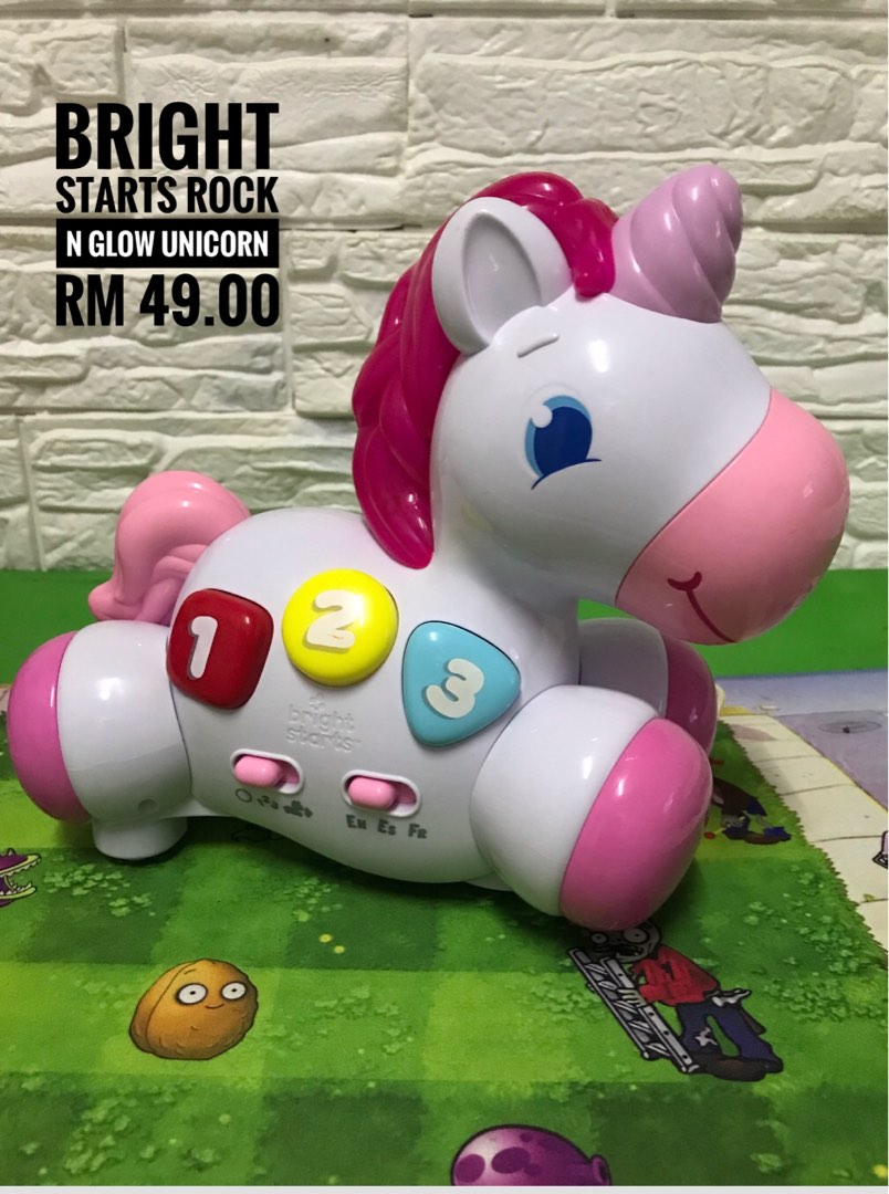 Bright starts rock hot sale and glow unicorn toy