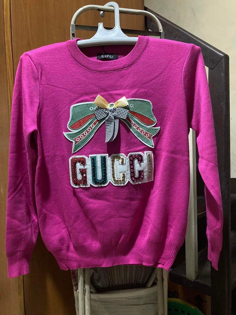 Knitted Gucci Top (premium quality) (Category: Coats, Jackets and Outerwear) located in Makati City. Submitted by matchmatch (Listing ID 1211402826, Image 1). Description: Available color: Magenta and White only FREE SIZE - fits small to XL frame Premium quality, last 2 pieces PAYMENT FIRST before shipping GCash or Metrobank only Will not respond to low-ballers Get both items for P2,800 Buyer pays shipping fee #gucci #sweater #knitted #knitwear #
