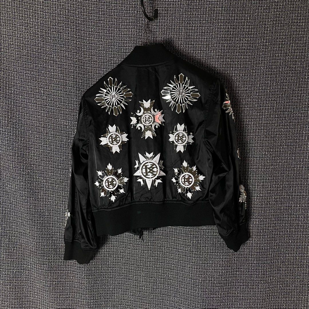 KTZ | Kokon To Zai Cropped Bomber Jacket (Category: Luxury Apparel) located in Bulacan. Submitted by vanitylab (Listing ID 1211457980, Image 2). Description: Size: Tagged Xsmall Womens Dimension: 20 W x 22 L Condition: 9/10 Made in: Korea Description: Front to back reflective design, Fits to Small- Medium Mens Cropped. - Can provide more details like measurements, for Shirts and Jackets : Shoulder to shoulder, Hem, Sleeve length, For bottoms : In