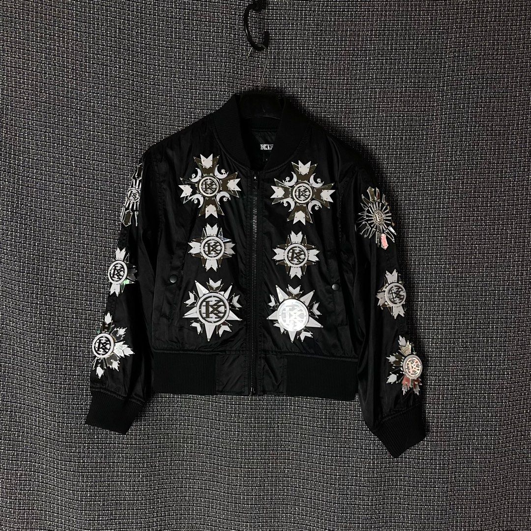 KTZ | Kokon To Zai Cropped Bomber Jacket (Category: Luxury Apparel) located in Bulacan. Submitted by vanitylab (Listing ID 1211457980, Image 1). Description: Size: Tagged Xsmall Womens Dimension: 20 W x 22 L Condition: 9/10 Made in: Korea Description: Front to back reflective design, Fits to Small- Medium Mens Cropped. - Can provide more details like measurements, for Shirts and Jackets : Shoulder to shoulder, Hem, Sleeve length, For bottoms : In