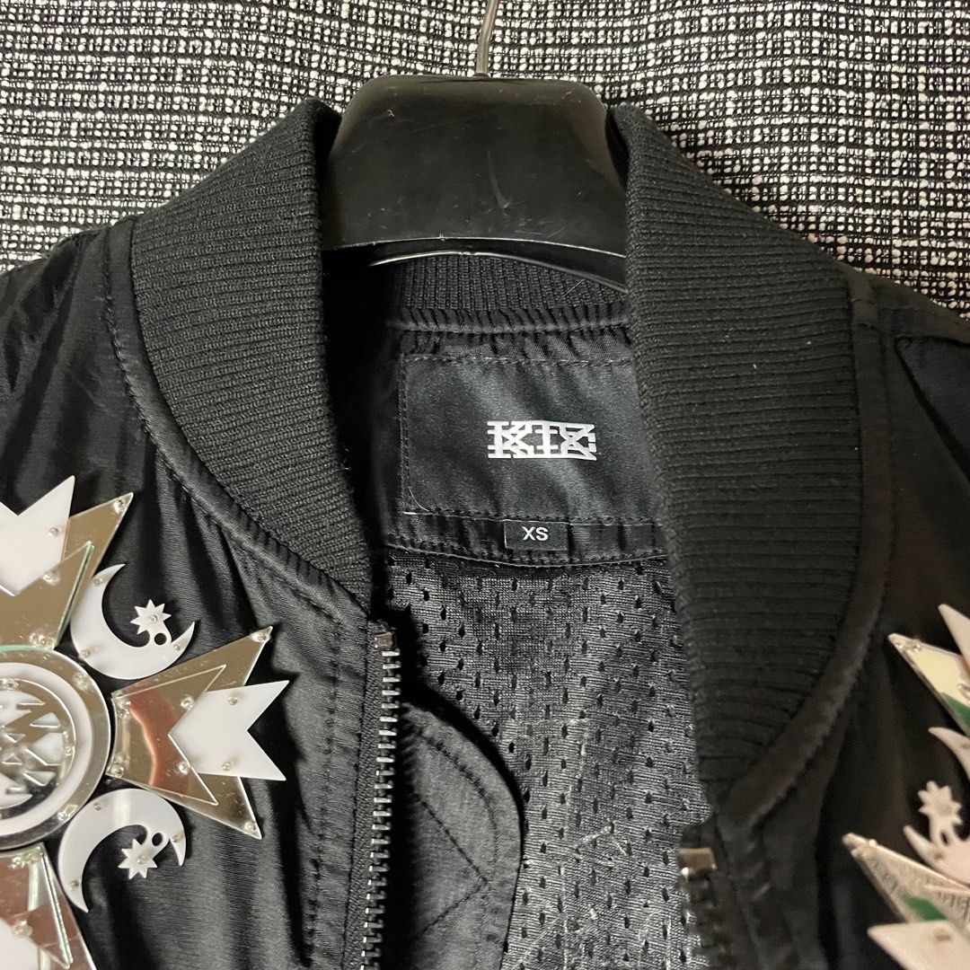 KTZ | Kokon To Zai Cropped Bomber Jacket (Category: Luxury Apparel) located in Bulacan. Submitted by vanitylab (Listing ID 1211457980, Image 3). Description: Size: Tagged Xsmall Womens Dimension: 20 W x 22 L Condition: 9/10 Made in: Korea Description: Front to back reflective design, Fits to Small- Medium Mens Cropped. - Can provide more details like measurements, for Shirts and Jackets : Shoulder to shoulder, Hem, Sleeve length, For bottoms : In
