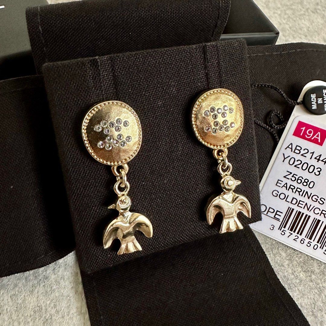 Used chanel earrings top
