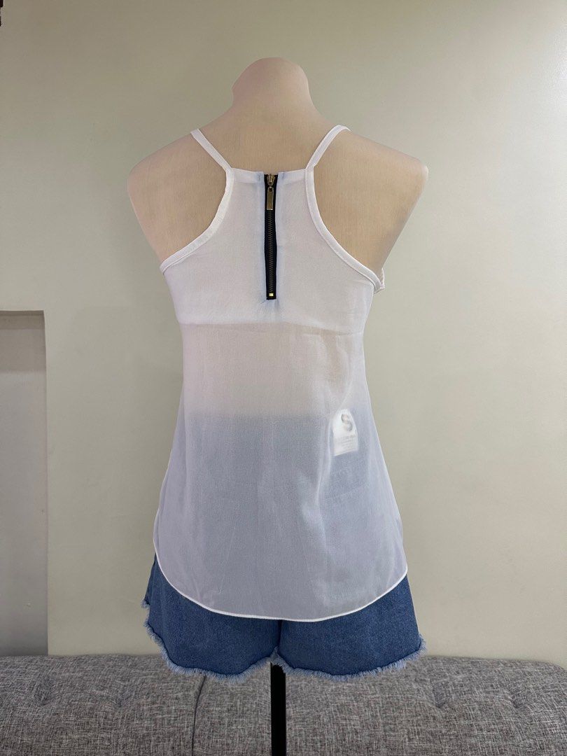 White Sleeveless Top (See-through at the back) (Category: Sleeveless) located in Quezon City. Submitted by puffclosetph (Listing ID 1211416672, Image 2). Description: ✅ Fits Small to Medium ❌ Shorts not included.