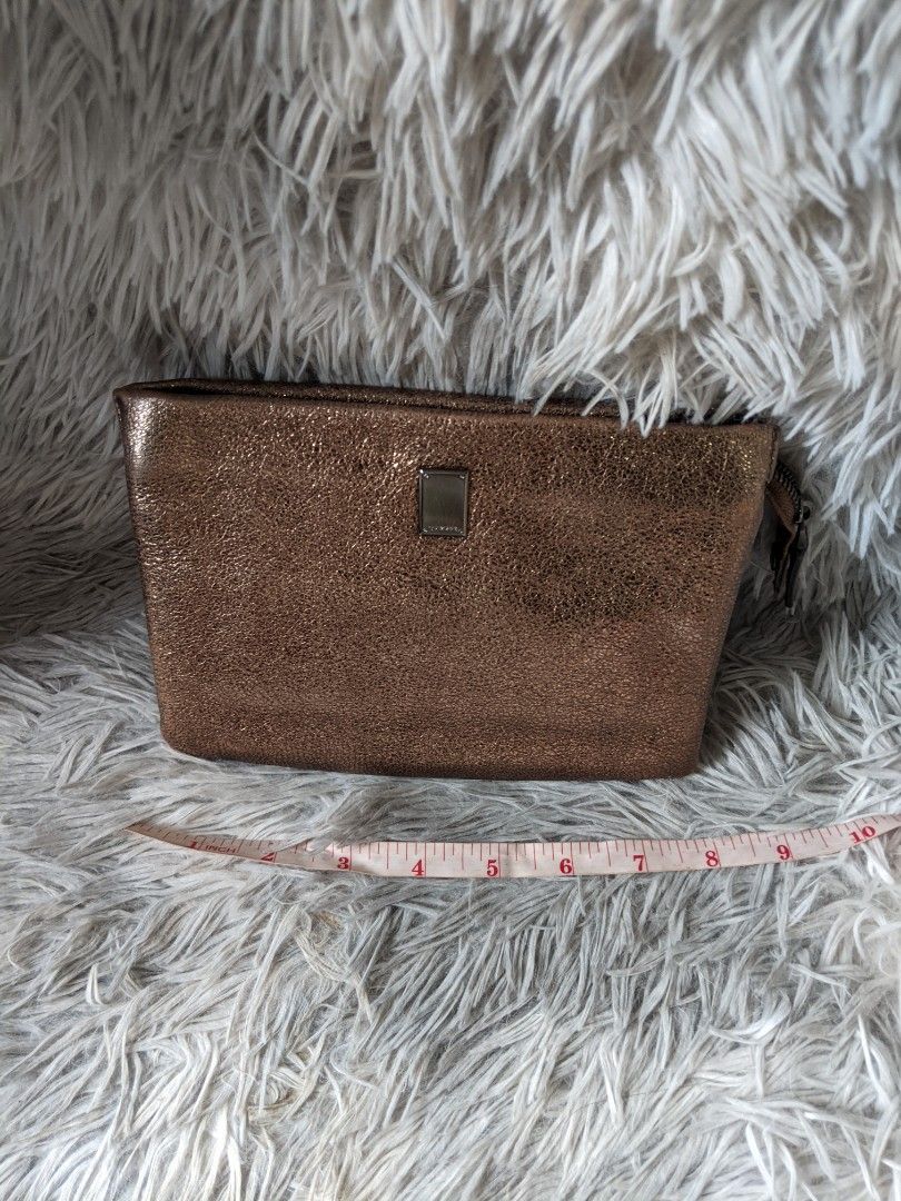Couronne Metallic Wallet Sling Bag (Category: Luxury Bags & Wallets) located in Makati City. Submitted by zzzzainab (Listing ID 1211685364, Image 2). Description: Preloved bag from Korea Gunmetal hardware Bronze leather With code and original sling! So pretty! Please refer to pictures for any flaws.